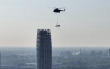 Installation of a crane by helicopter on Obchodna Street